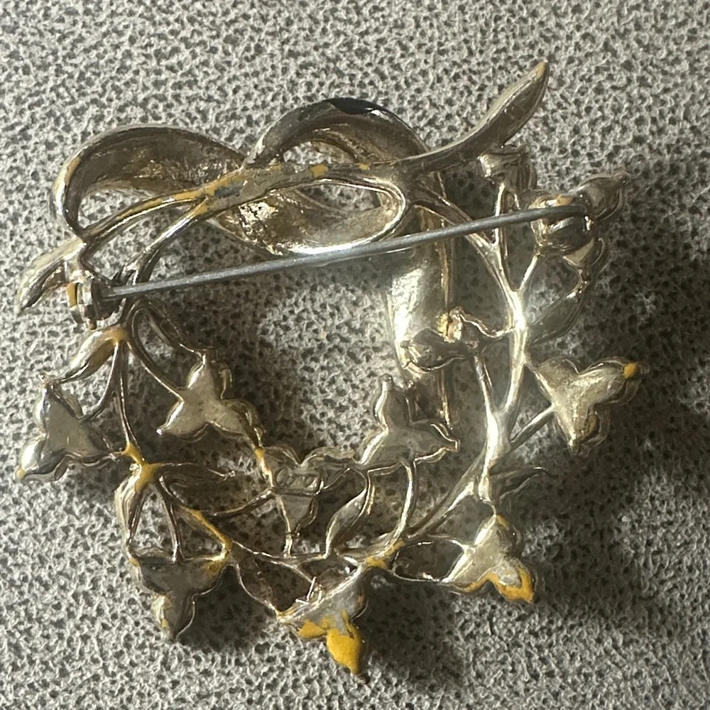 Elegant Gold and Black Brooch